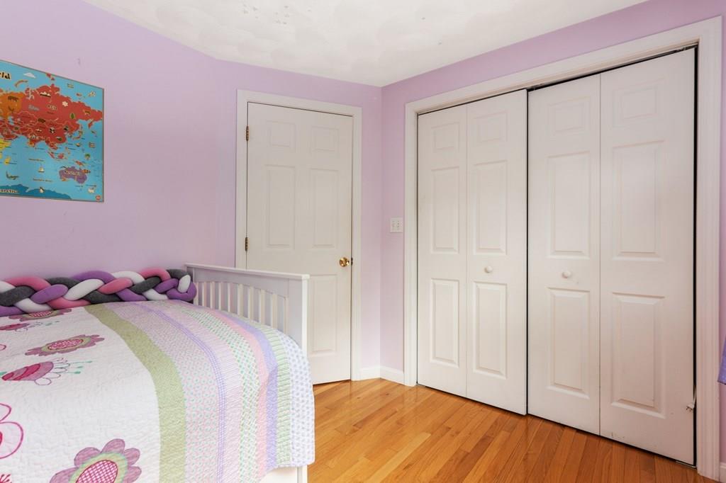 37 Middle Road Newbury, MA 01951 - Photo 26 of 42 a bedroom with a bed and a painting on the wall