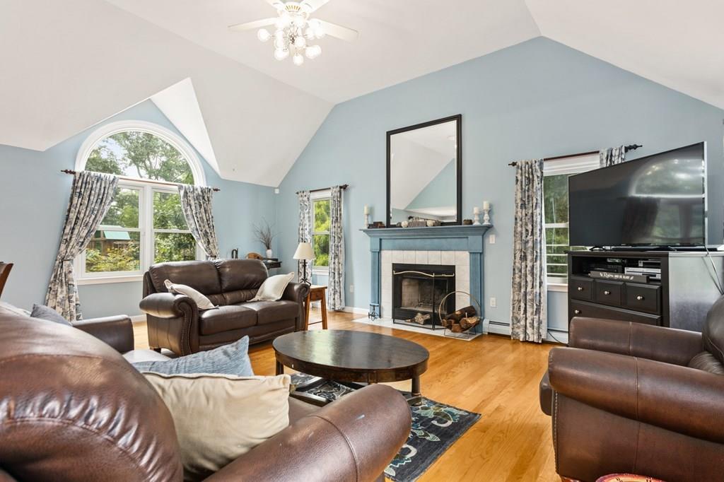 37 Middle Road Newbury, MA 01951 - Photo 3 of 42 a living room with furniture a flat screen tv and a fireplace