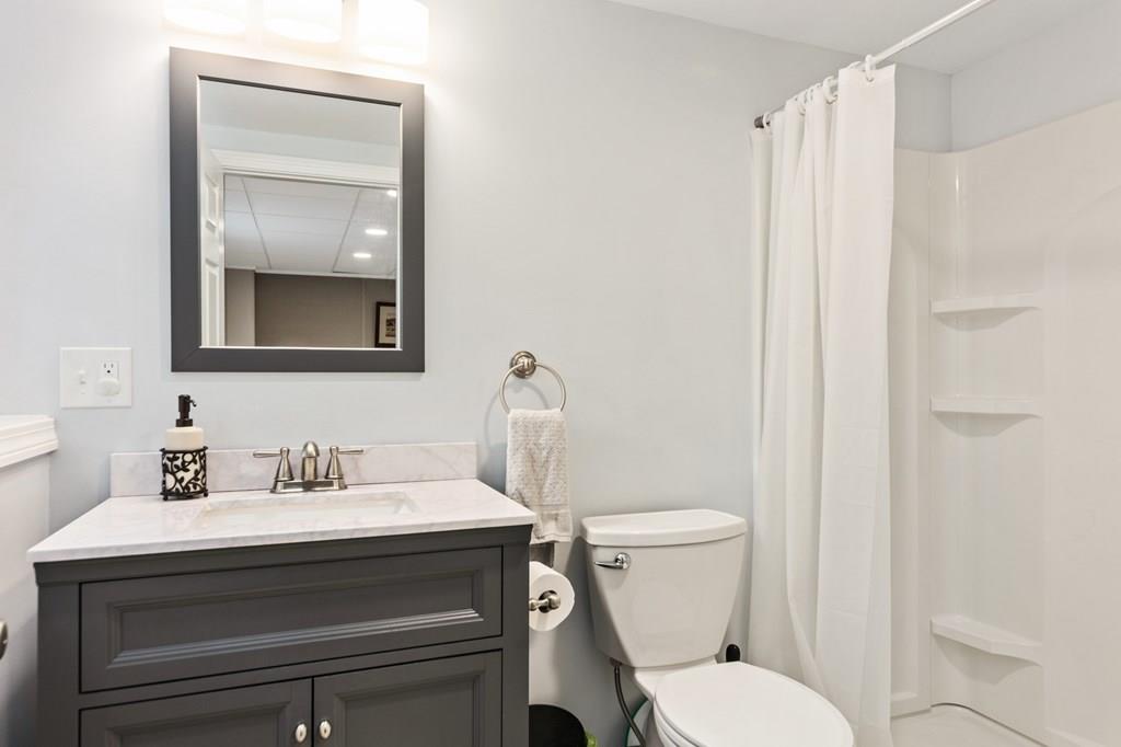 37 Middle Road Newbury, MA 01951 - Photo 32 of 42 a bathroom with a sink toilet and mirror