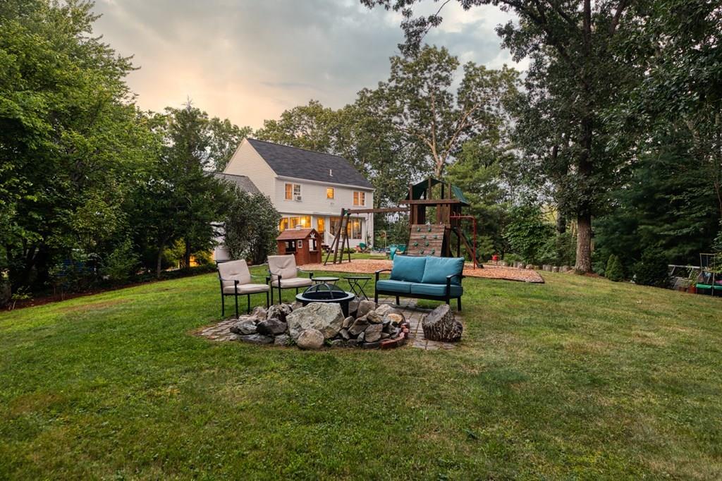 37 Middle Road Newbury, MA 01951 - Photo 36 of 42 a view of a chair and table in backyard of the house