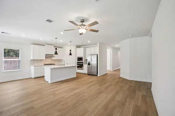 a view of kitchen with wooden floor and window