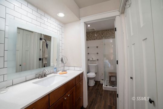 313 East Haloid Avenue Ridgecrest, CA 93555 - Photo 20 of 39 a bathroom with a double vanity sink a mirror and a toilet
