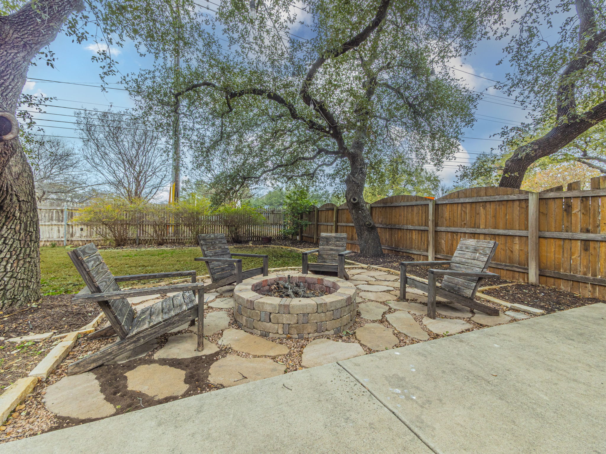 1002 Boxwood Loop Georgetown, TX 78628 - Photo 24 of 25 Fenced backyard with an outdoor fire pit and a patio area