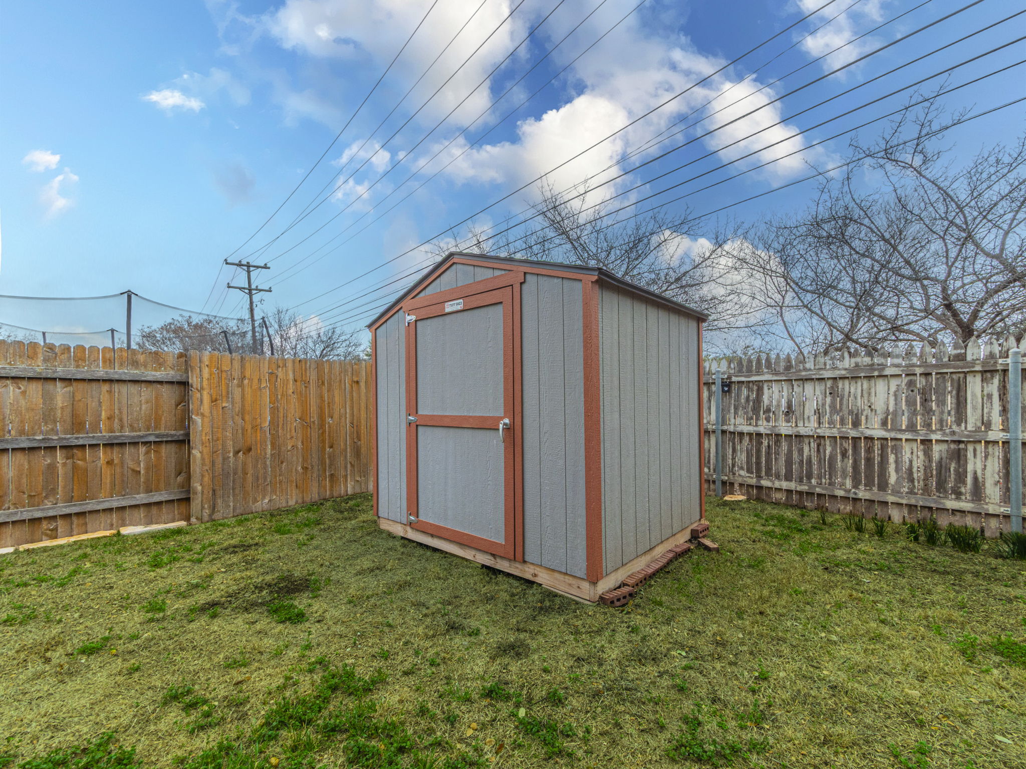 1002 Boxwood Loop Georgetown, TX 78628 - Photo 25 of 25 View of shed with a fenced backyard