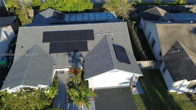 an aerial view of houses with outdoor space