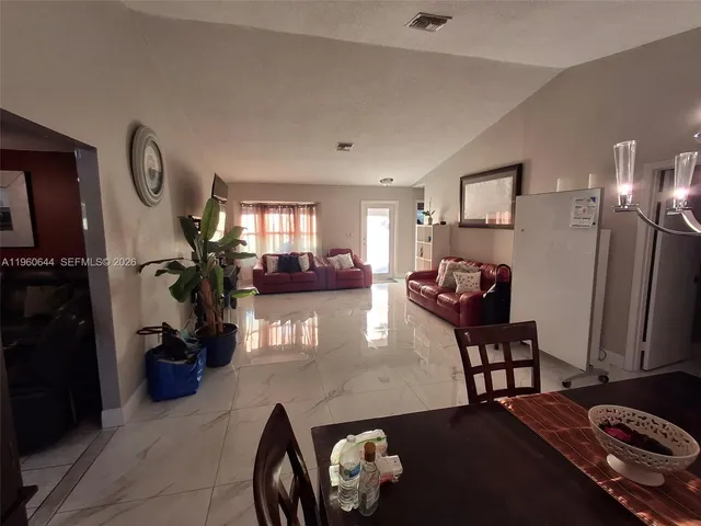 a kitchen with a refrigerator microwave and stove