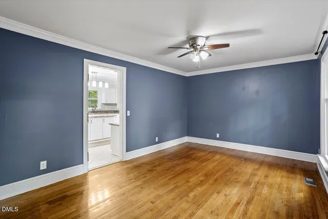 a bathroom with a granite countertop toilet sink and mirror