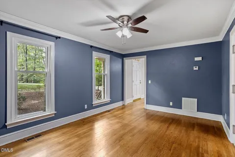 an entryway with a white walls and stairs