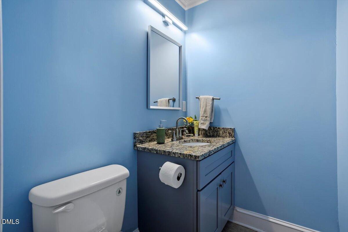 309 Appaloosa Trail Bahama, NC 27503 - Photo 19 of 45 a bathroom with a granite countertop toilet sink and mirror