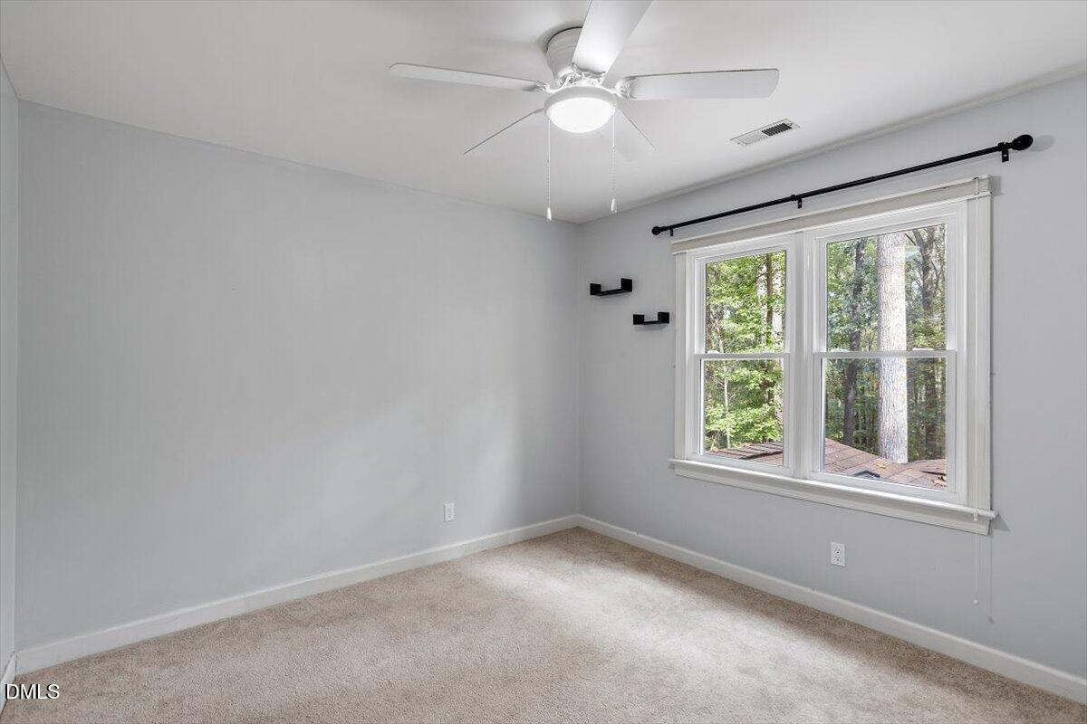 309 Appaloosa Trail Bahama, NC 27503 - Photo 24 of 45 an empty room with a window and a fan