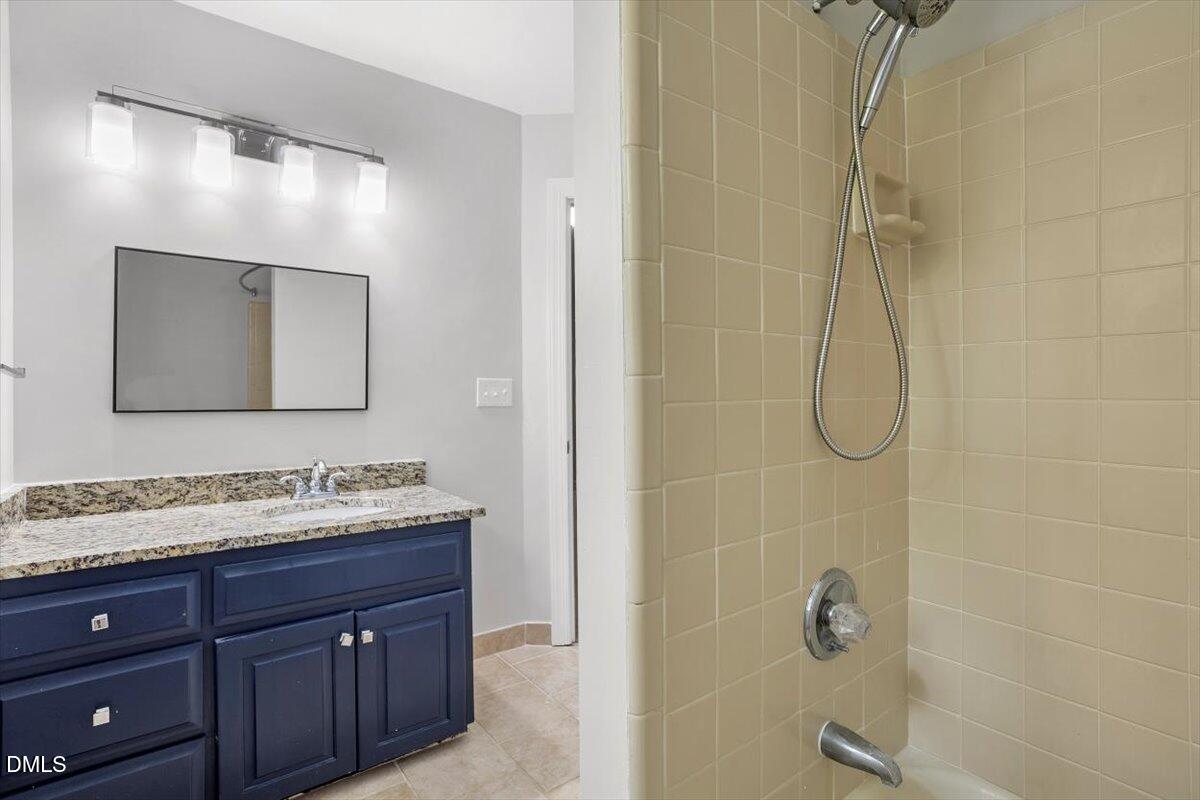 309 Appaloosa Trail Bahama, NC 27503 - Photo 25 of 45 a bathroom with a sink vanity granite and shower