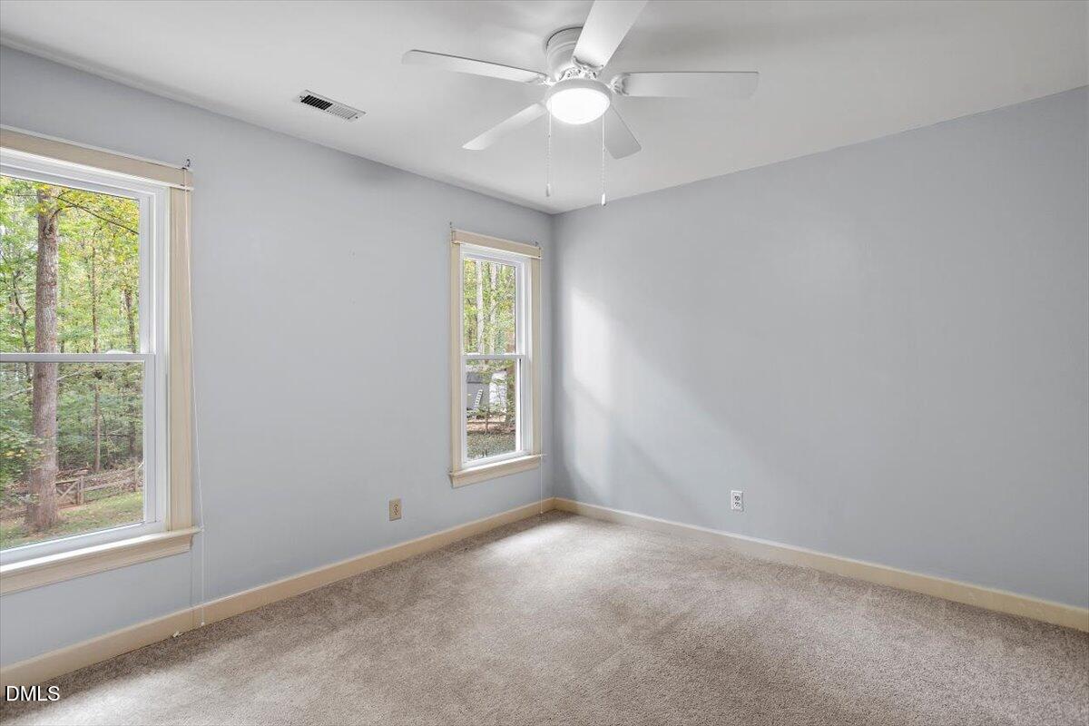 309 Appaloosa Trail Bahama, NC 27503 - Photo 28 of 45 an empty room with windows and fan