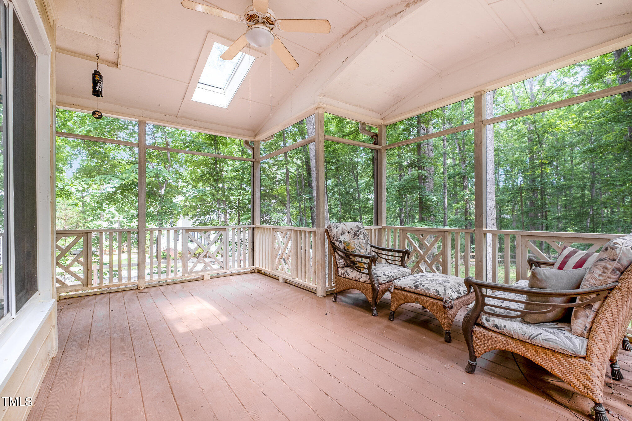 309 Appaloosa Trail Bahama, NC 27503 - Photo 32 of 45 a living room with furniture and a floor to ceiling window