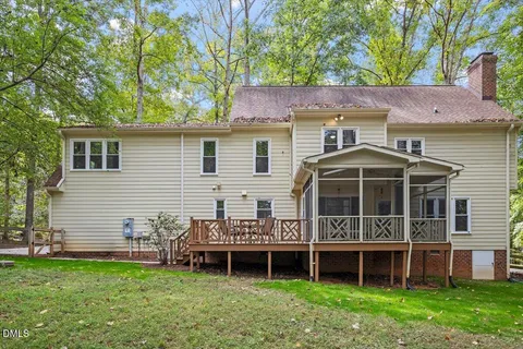 a view of a brick house with many windows