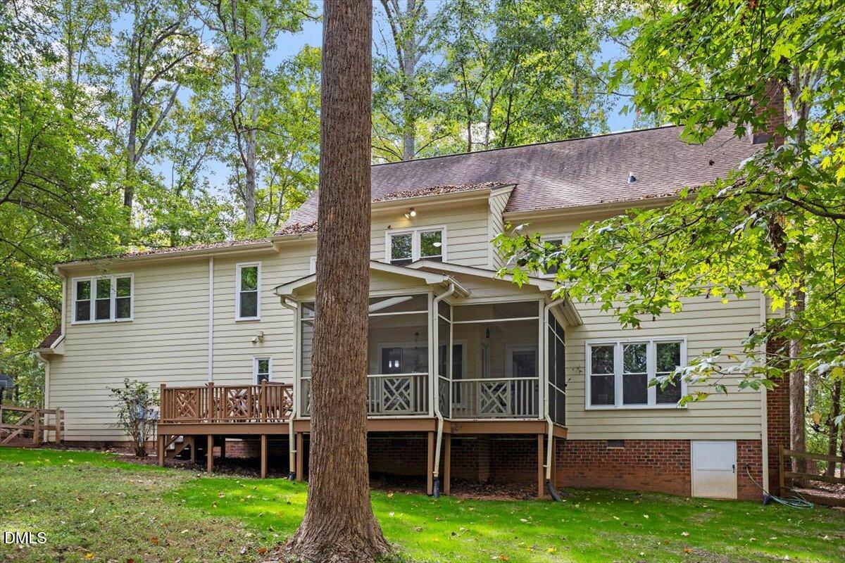 309 Appaloosa Trail Bahama, NC 27503 - Photo 38 of 45 a front view of a house with a garden and yard