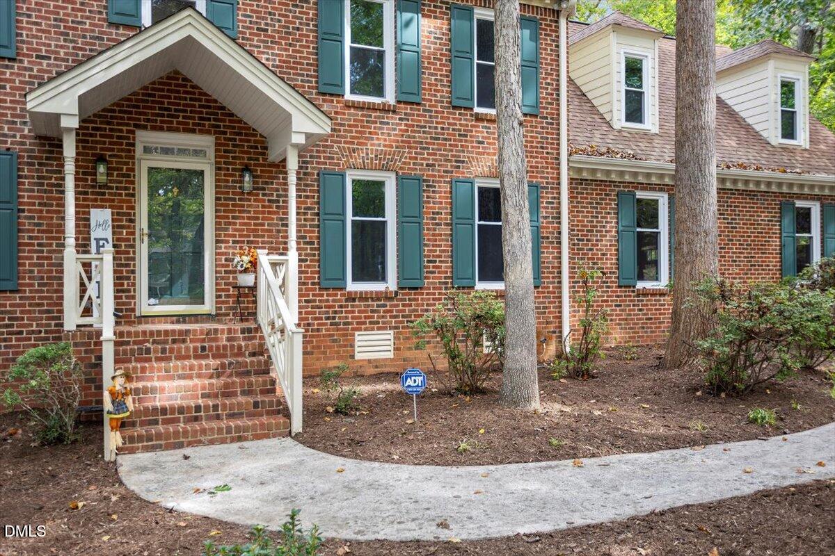 309 Appaloosa Trail Bahama, NC 27503 - Photo 39 of 45 a view of a brick house with many windows