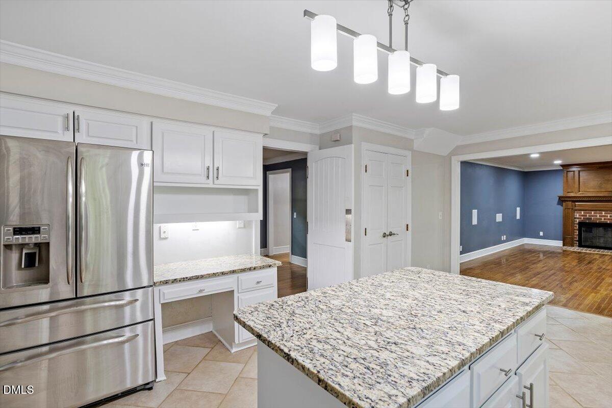 309 Appaloosa Trail Bahama, NC 27503 - Photo 6 of 45 a kitchen with kitchen island sink refrigerator and cabinets