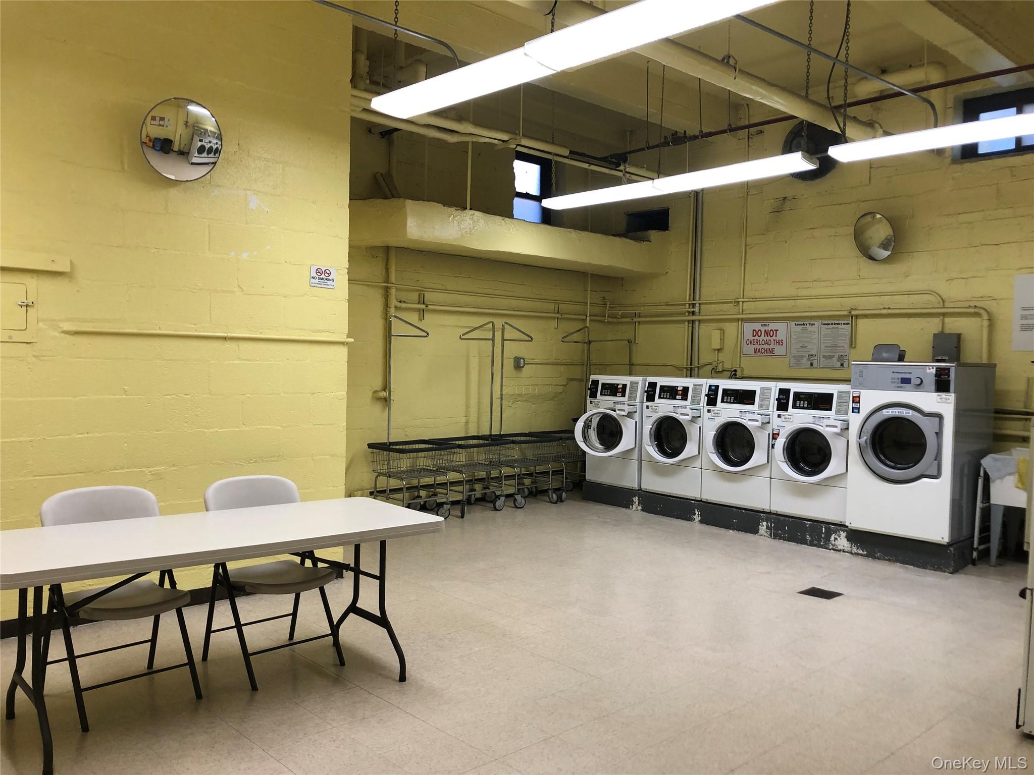 99-10 60th Avenue, Unit 1E Queens, NY 11368 - Photo 18 of 18 a room with a table and chairs