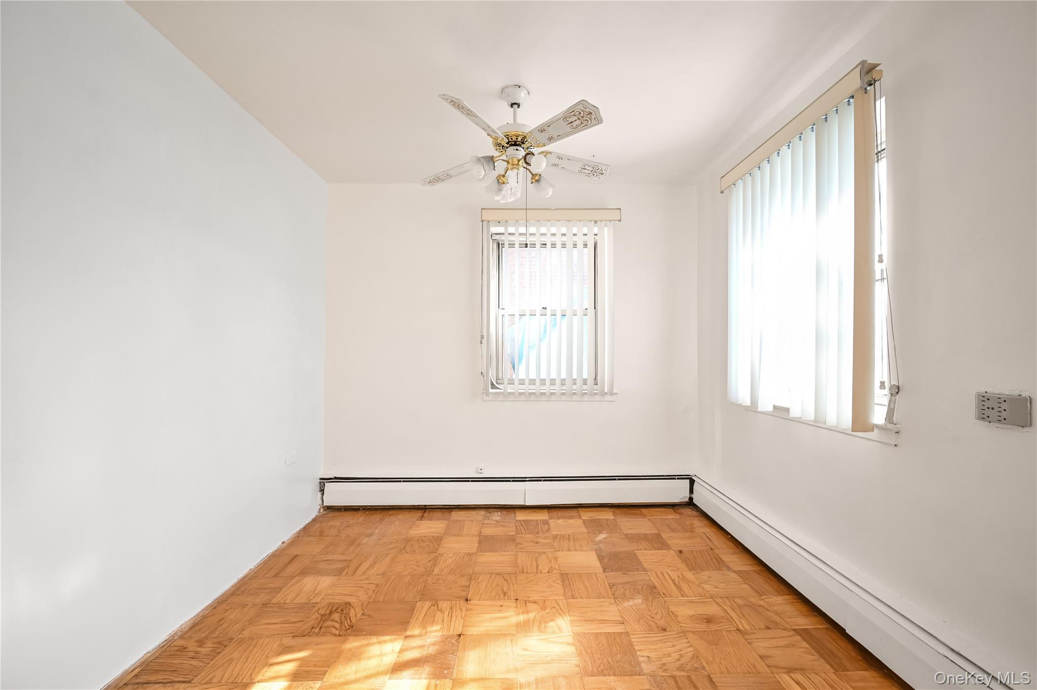 99-10 60th Avenue, Unit 1E Queens, NY 11368 - Photo 9 of 18 a view of an empty room with a window
