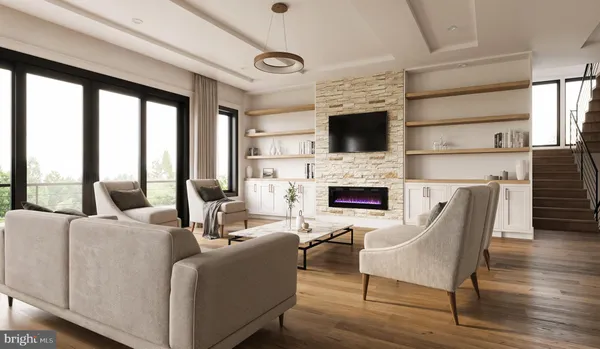 a living room with furniture a flat screen tv and a fireplace