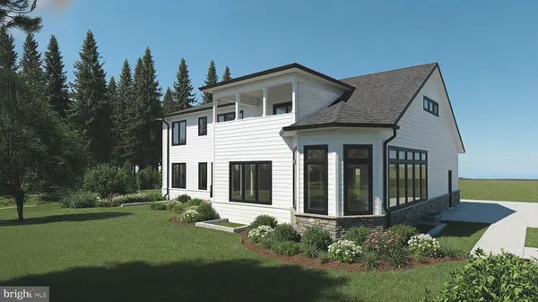 a front view of a house with a garden and plants