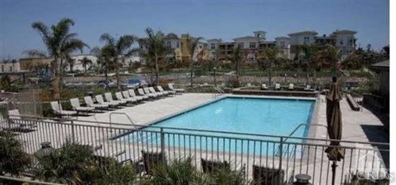 1430 Windshore Way Oxnard, CA 93035 - Photo 18 of 55 a view of a swimming pool with a patio and plants