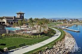 1430 Windshore Way Oxnard, CA 93035 - Photo 20 of 55 a view of a lake with a house in the background