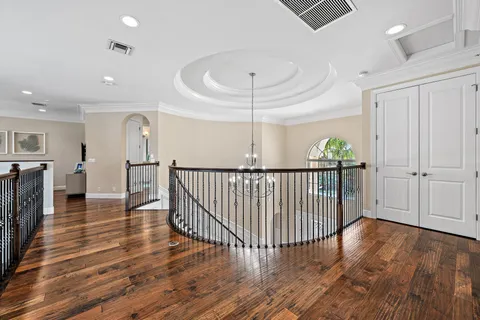 a bedroom with bed and a large window