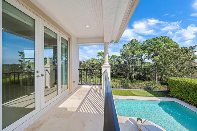 a view of swimming pool from a living room