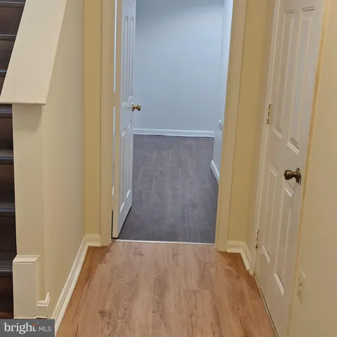 a back view of a house with wooden deck