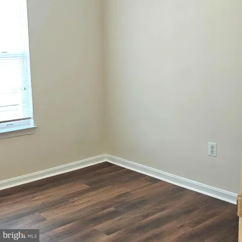 a bathroom with a toilet and a bathtub
