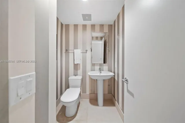 a bedroom with bed and a tv