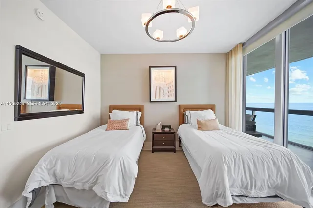 a living room with furniture and a book shelf