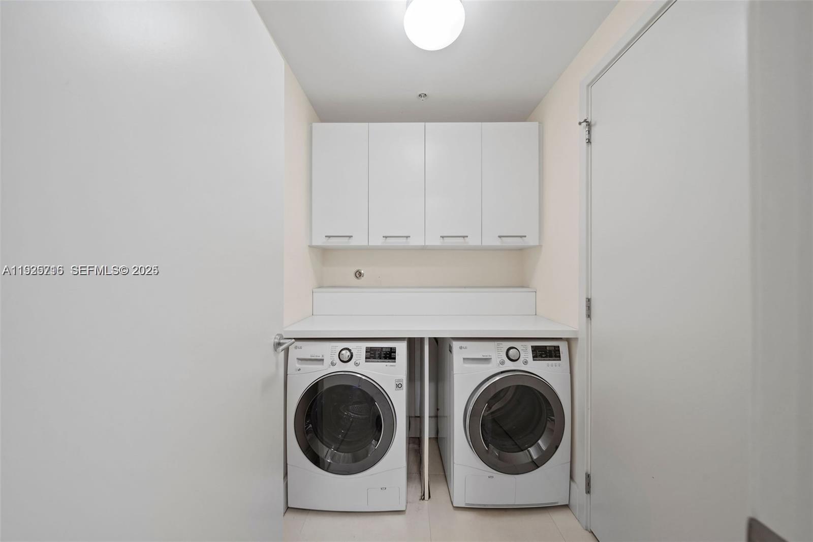 6899 Collins Avenue, Unit 1801 Miami Beach, FL 33141 - Photo 31 of 67 a utility room with sink dryer and washer