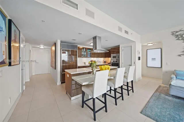 a view of a living room and kitchen