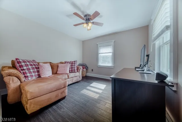 a living room with furniture and windows