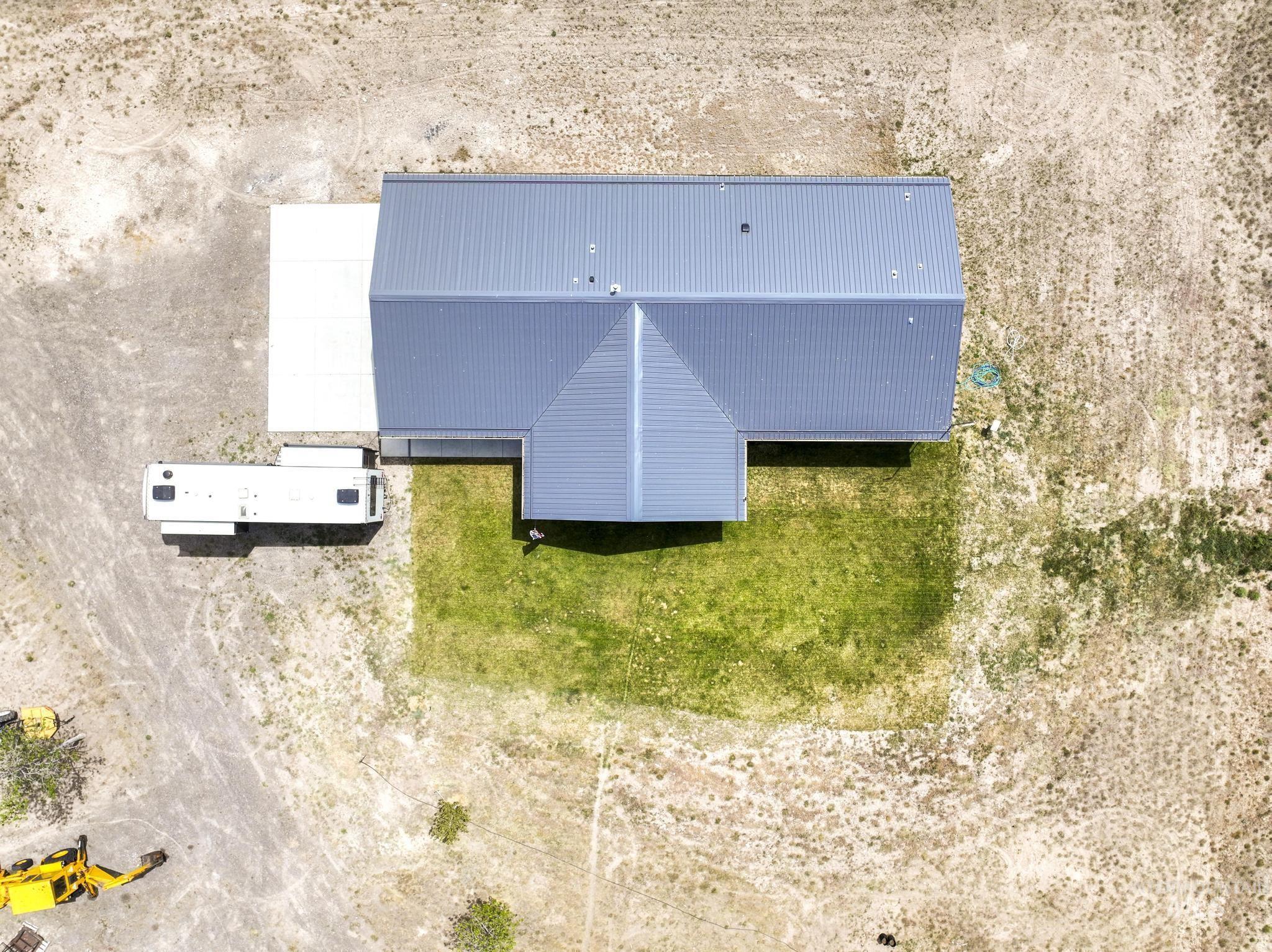 758 Cedar Crk Road Rogerson, ID 83302 - Photo 44 of 50 Contemporary property featuring a metal roof, partial green lawn, and a concrete pad