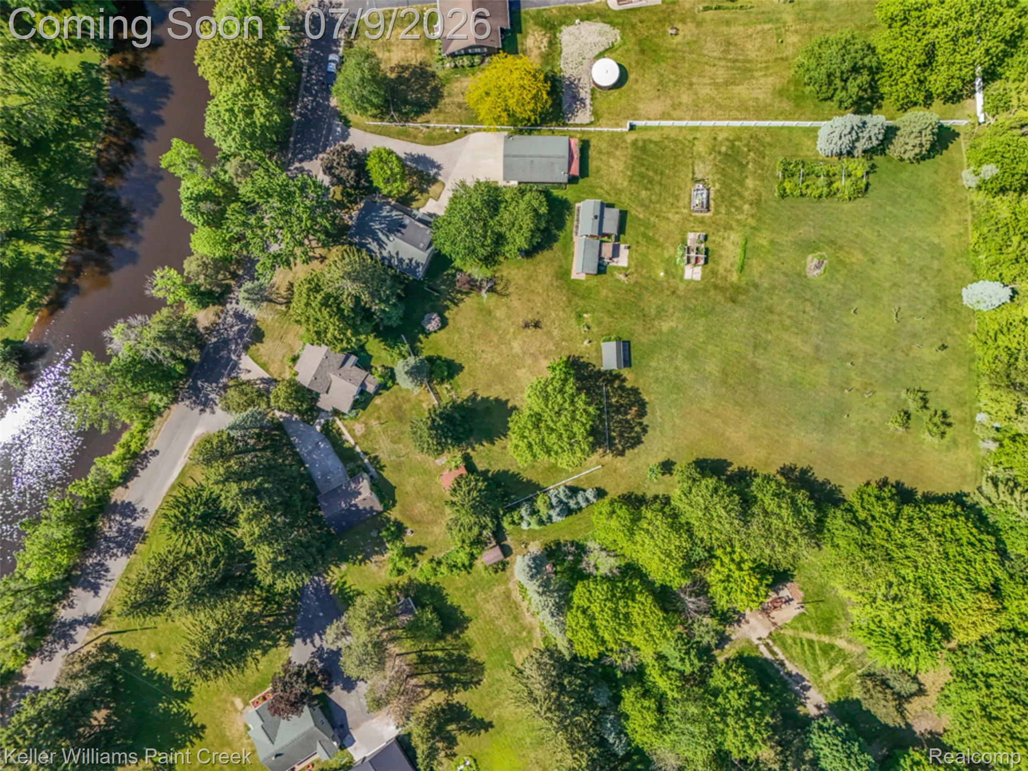 204 Russell Road Kawkawlin, MI 48631 - Photo 64 of 82 Aerial perspective showcasing the property's expansive green spaces and tree coverage