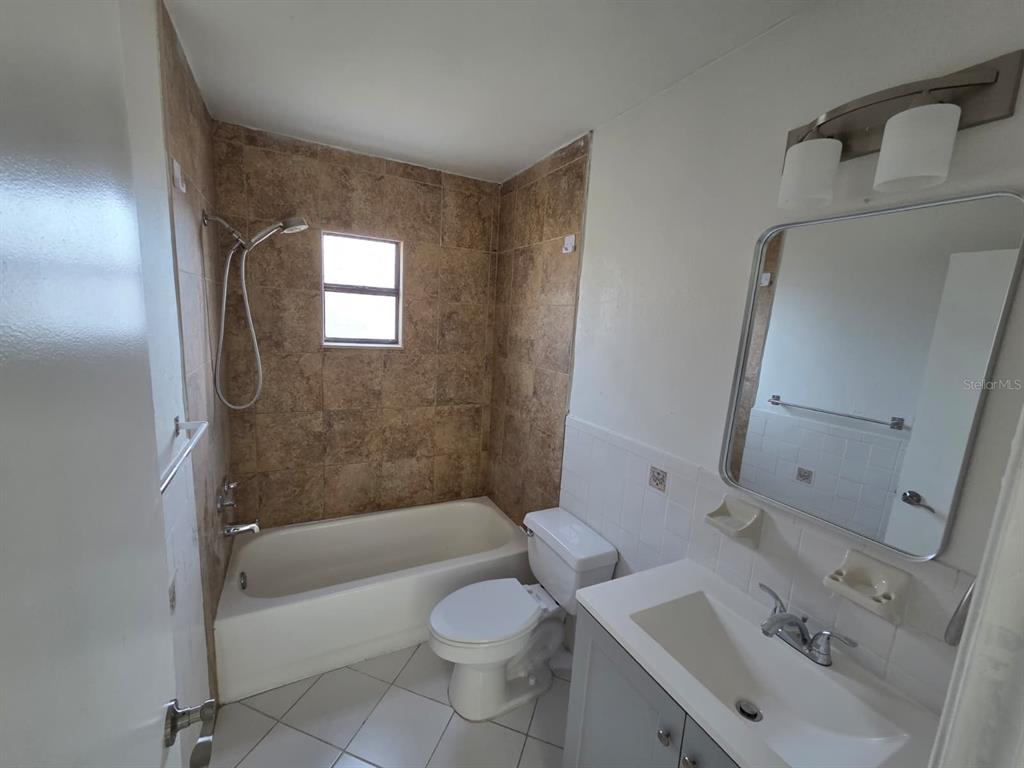 12200 Norvell Road Spring Hill, FL 34609 - Photo 11 of 16 a bathroom with a sink toilet and shower