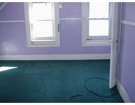 131 Adams Street Lynn, MA 01902 - Photo 2 of 5 a view of a window in an empty room