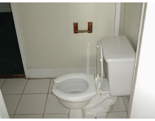131 Adams Street Lynn, MA 01902 - Photo 3 of 5 a bathroom with a toilet and a sink