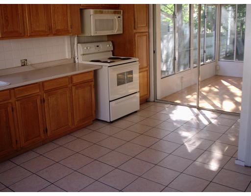 131 Adams Street Lynn, MA 01902 - Photo 4 of 5 a kitchen with a sink cabinets and appliances