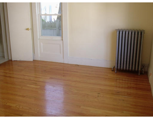 131 Adams Street Lynn, MA 01902 - Photo 5 of 5 a view of wooden floor and windows in a room