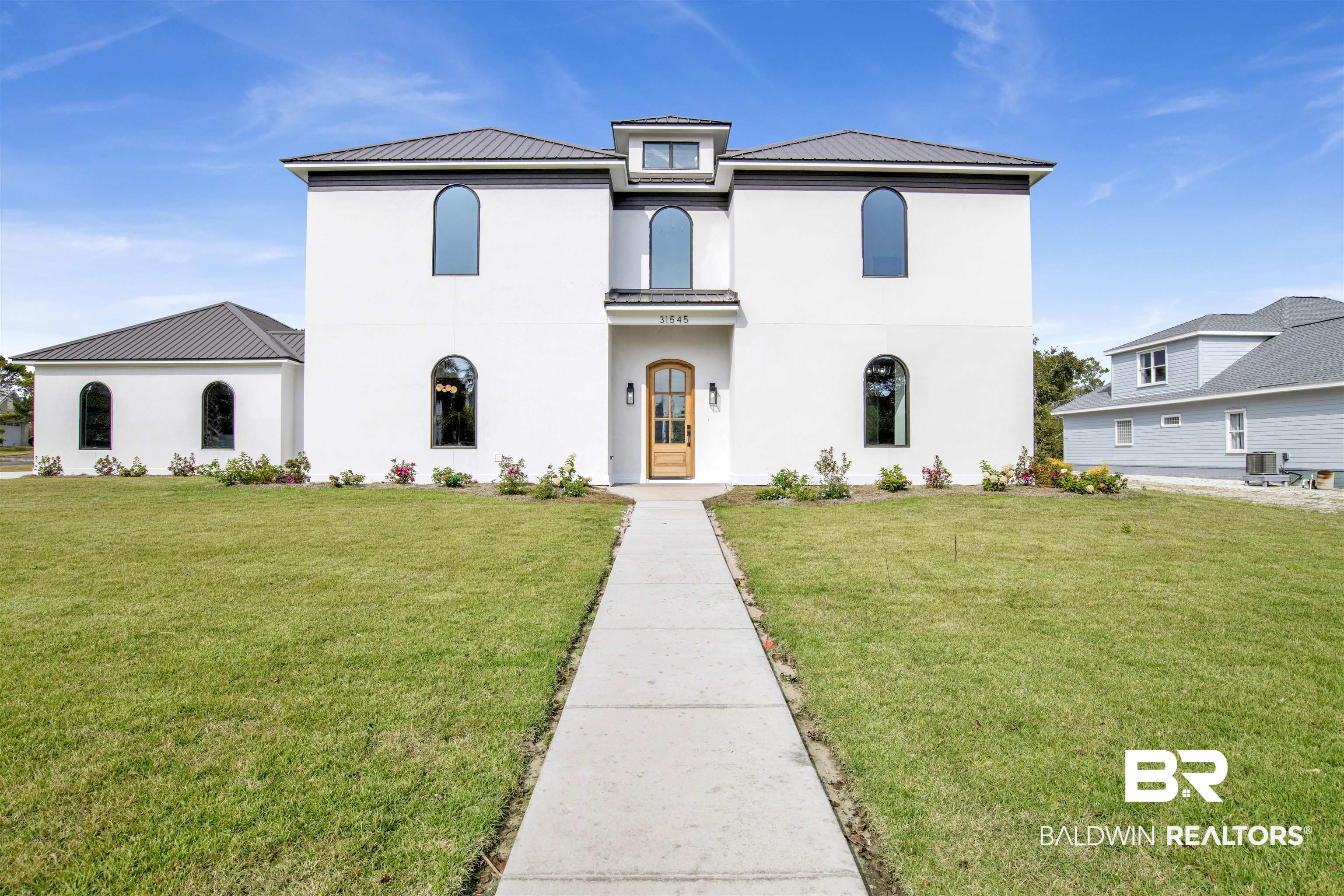 31545 River Road Orange Beach, AL 36561 - Photo 41 of 59 Mediterranean / spanish-style house featuring a front yard and central AC
