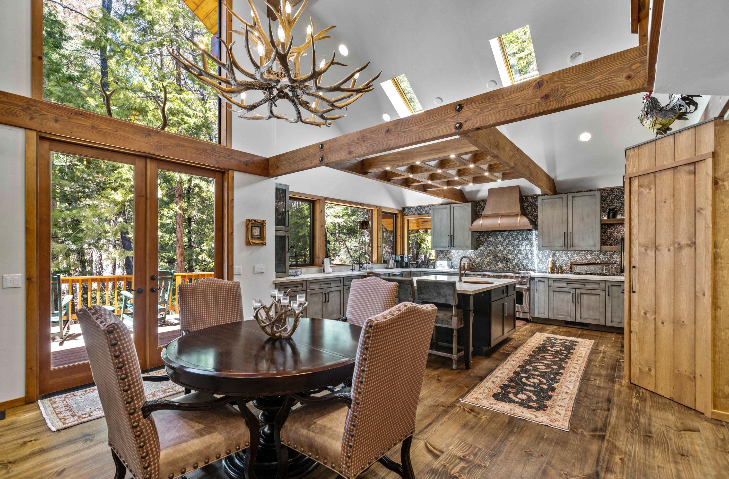 24581 Fern Valley Road Idyllwild, CA 92549 - Photo 12 of 45 a view of a dining room with furniture window and outside view