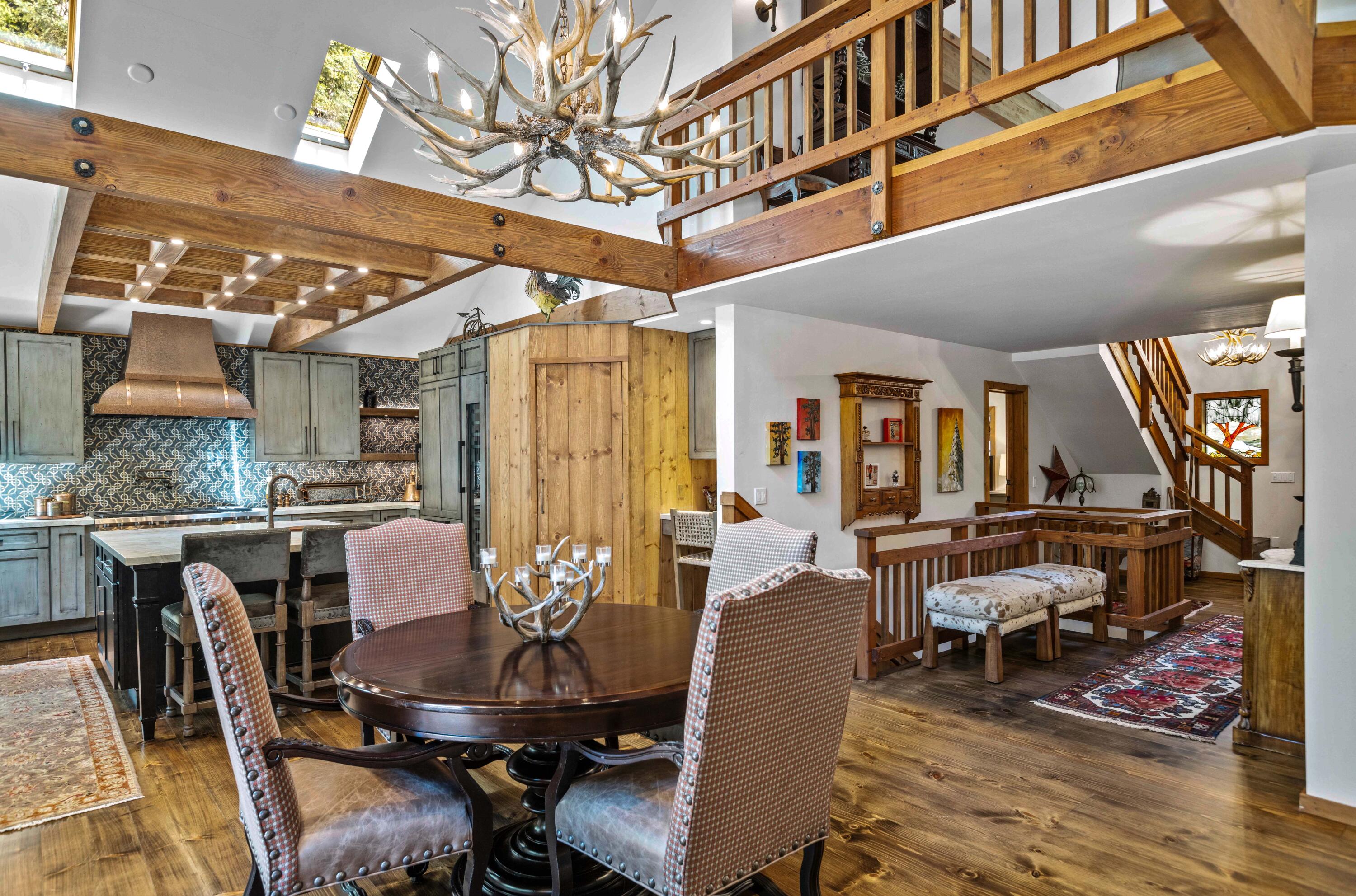 24581 Fern Valley Road Idyllwild, CA 92549 - Photo 13 of 45 a view of a dining room with furniture window and wooden floor