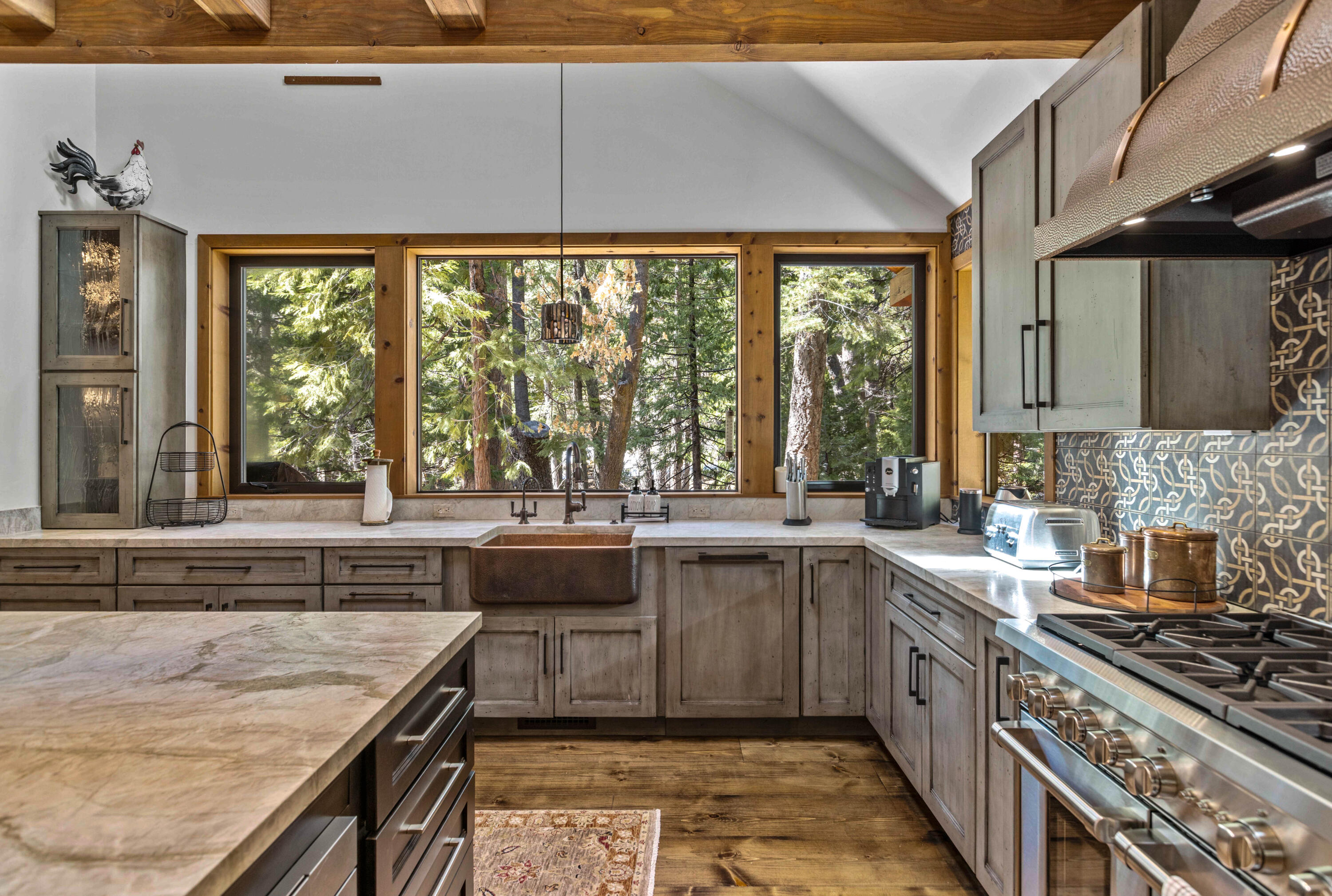 24581 Fern Valley Road Idyllwild, CA 92549 - Photo 16 of 45 a kitchen with a sink stove and cabinets