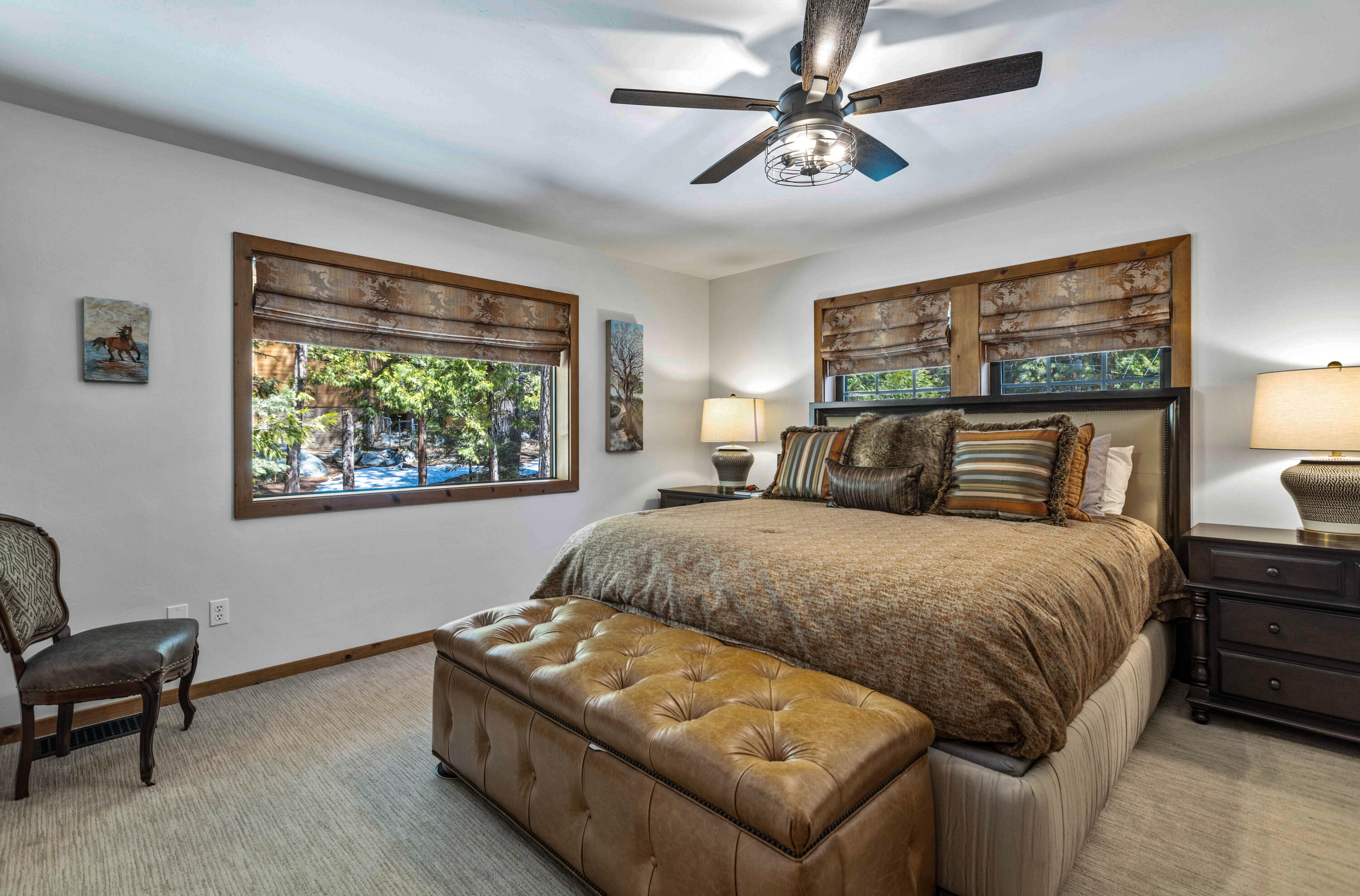 24581 Fern Valley Road Idyllwild, CA 92549 - Photo 19 of 45 a bedroom with a bed and a painting on the wall