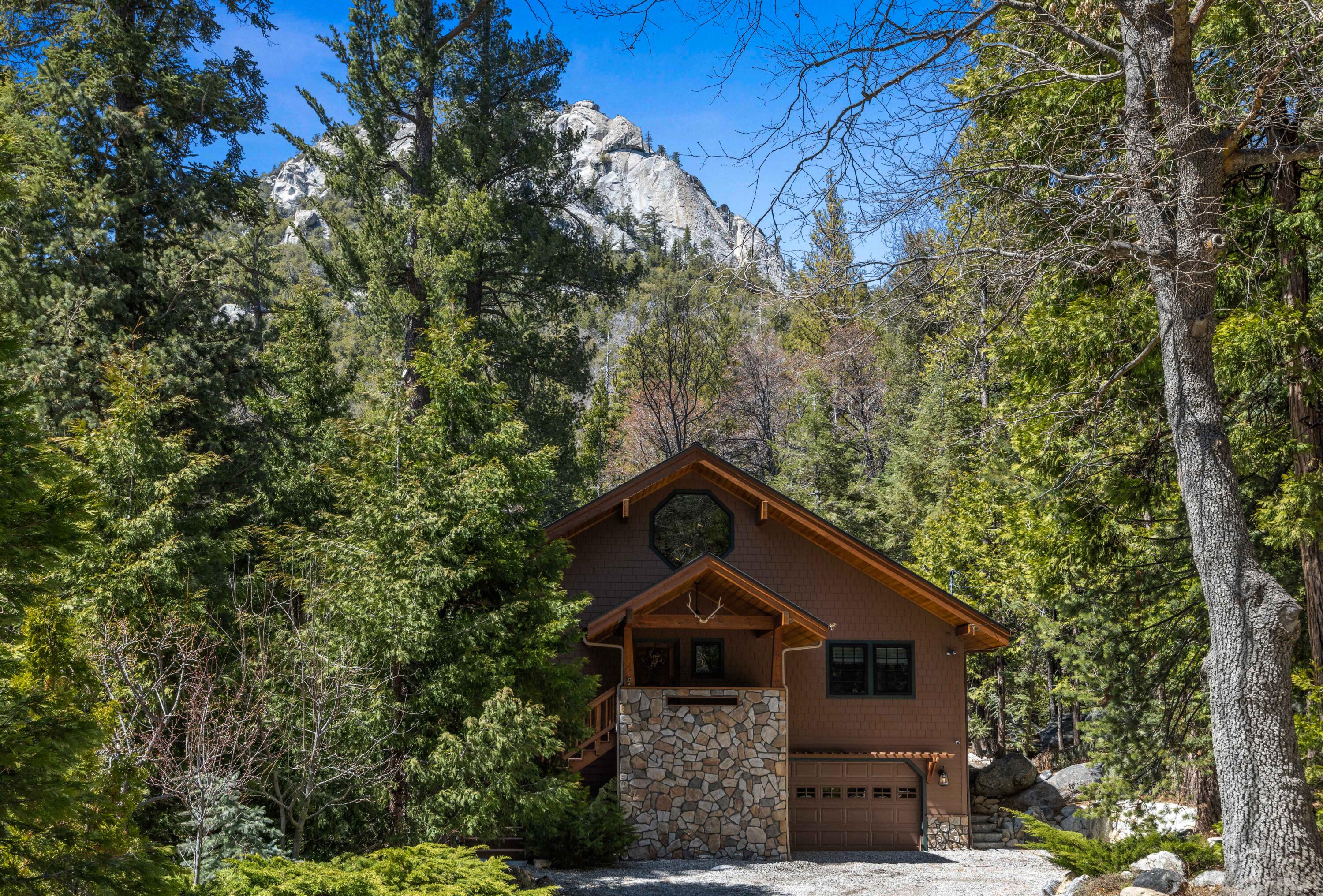 24581 Fern Valley Road Idyllwild, CA 92549 - Photo 2 of 45 a front view of a house with a tree