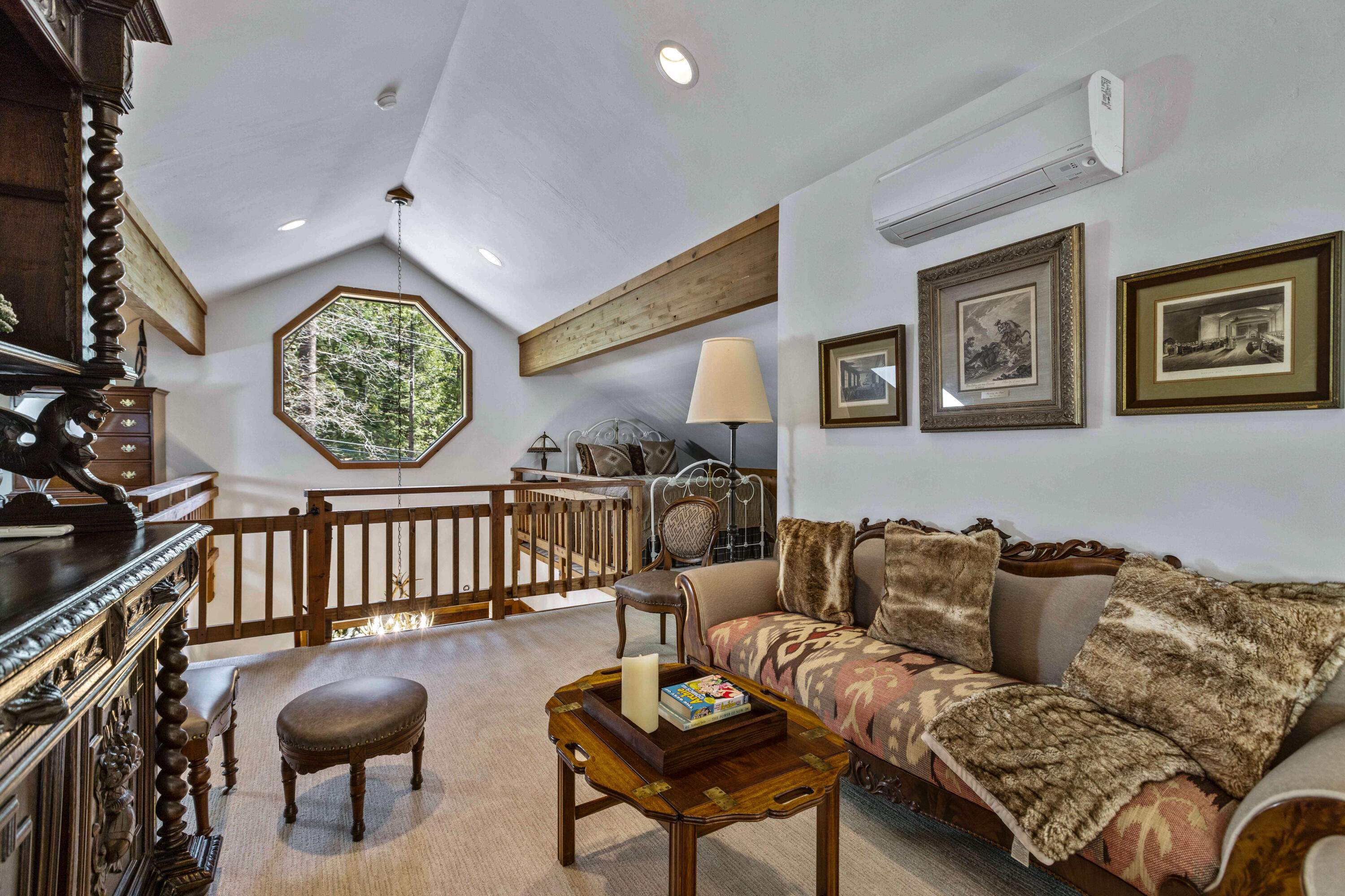 24581 Fern Valley Road Idyllwild, CA 92549 - Photo 29 of 45 a living room with furniture and a wall painting